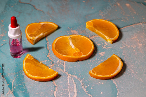 Pipettenfläschchen mit Orangenscheiben