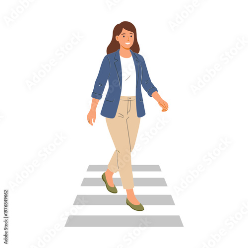 A woman wearing a blue jacket walks across a crosswalk