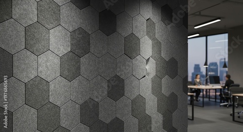 Modern interior design with hexagonal wall panels in an office space.