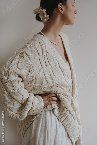 Fotografie Minimal Scandinavian Style Fashion Portrait With Cream Knit Cardigan And Muted T