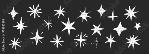 Quadro su tela Doodle hand drawn stars crayon sparkles set on blackboard