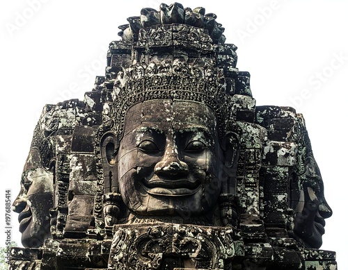 A stone face of an ancient temple guardian with intricate carvings