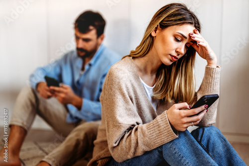 Gadget addiction and relationship problems. Couple with smartphones ignoring each other
