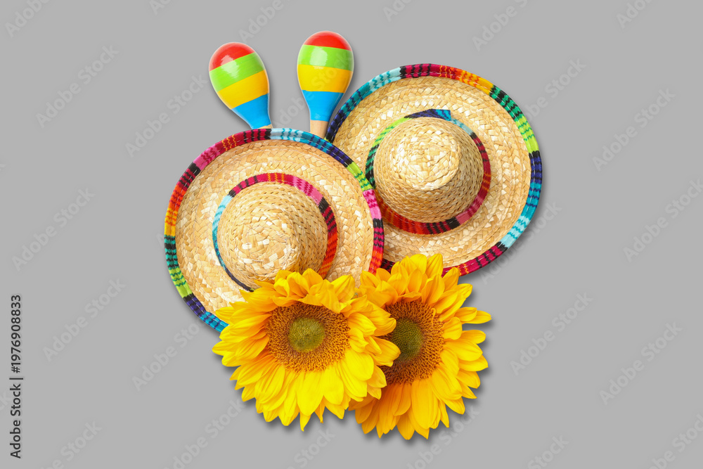 Fototapeta premium Cinco de Mayo, Two sombreros and maracas paired with bright sunflowers