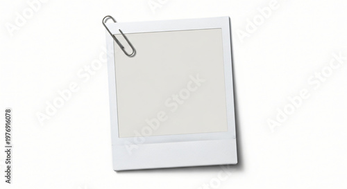 A blank yellow sticky note paper with a metal paperclip serves as an empty office memo or business reminder sheet on a white background for stationery document list messaging