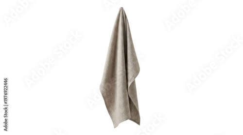 Isolated hanging beige textured fabric towel on white background