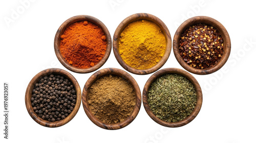 Assortment of isolated culinary ground spices and peppercorns in bowls
