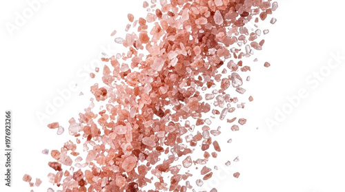 Isolated pink Himalayan salt crystals falling on white