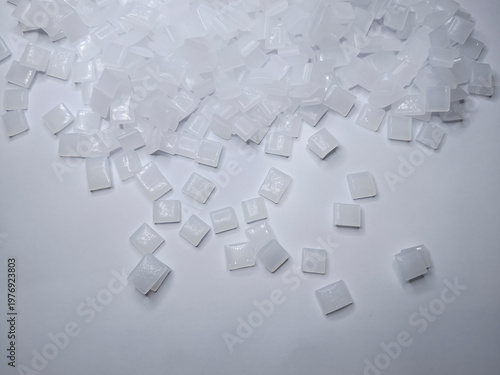 hot glue, dry glue beads, hot melt polymer, isolated on white background, for product catalog design profile industrial plastics
