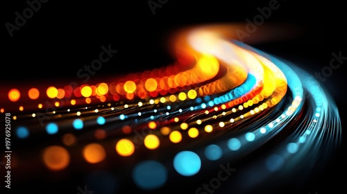 Abstract glowing light trails and bokeh effects on a dark background