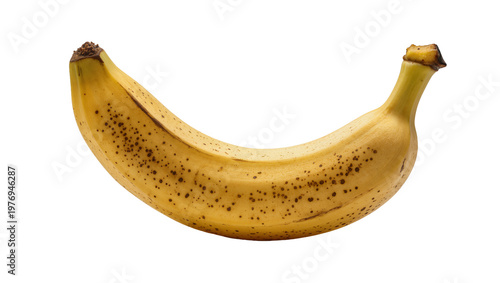 Ripe speckled yellow banana with brown tips and curved shape