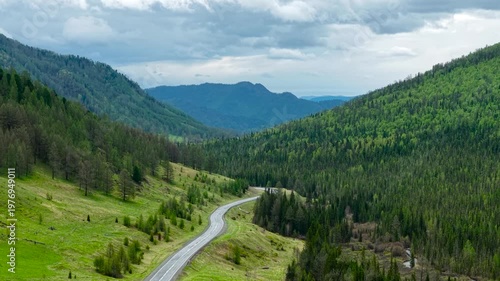 A journey across Russia, a journey through the Altai Republic. Cinematic views of the Seminsky Pass, a mountain road with a dramatic change in elevation. Drone video, Altai from a drone.