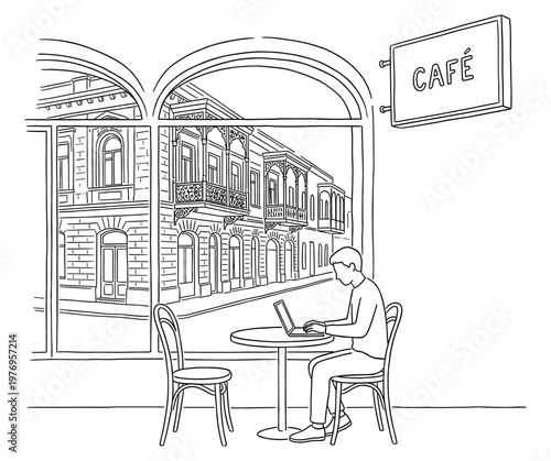 Digital nomad working on laptop in cafe with old street view sketch