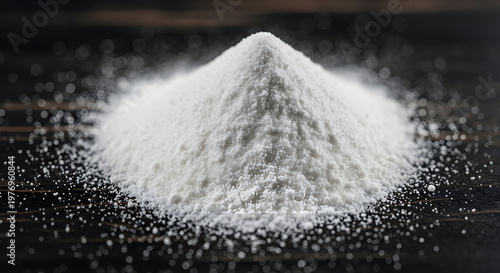 A pile of fine white powder on a dark textured surface