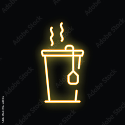 Neon yellow icon of a steaming cup of tea with a teabag hanging from the rim glowing on a black background