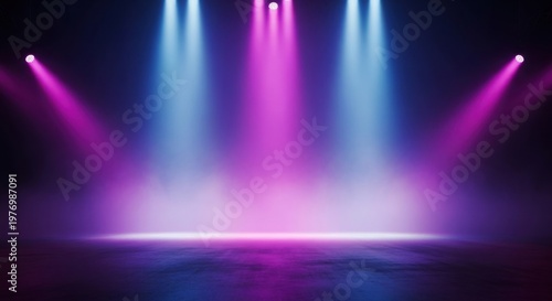 Vibrant stage lights in blue and pink hues on dark background
