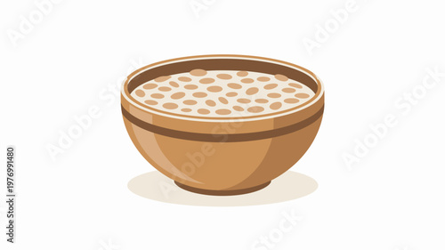 A clay bowl filled with a creamy dessert topped with small round sweet treats.