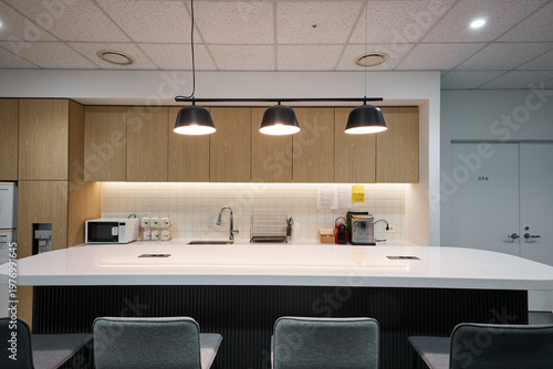 Cuadro en lienzo Office pantry or kitchenette with pendant lights and seating counter