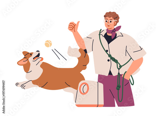 Dog playing, training with ball launcher. Teaching puppy with canine animal g...
