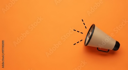 A megaphone on an orange background with black dotted lines emanating from it