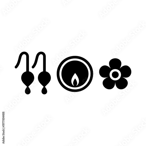 Black earrings, candle, and flower in a minimalistic composition