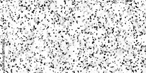 Black and white terrazzo texture seamless pattern with dark stone chips on light marble. A densely speckled abstract texture with varying shades of gray and black against a white background
