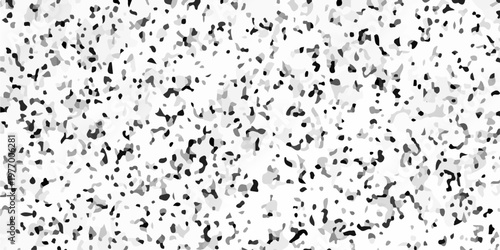 Black and white terrazzo texture seamless pattern with dark stone chips on light marble. A densely speckled abstract texture with varying shades of gray and black against a white background