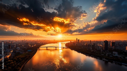 Dramatic Sunset Over Cityscape with River Reflection and Cloudscape Radiance.