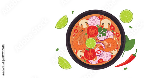 Top down view of a traditional thai tom yum soup bowl filled with shrimp and mushrooms and lime and onions and spicy red chilies.
