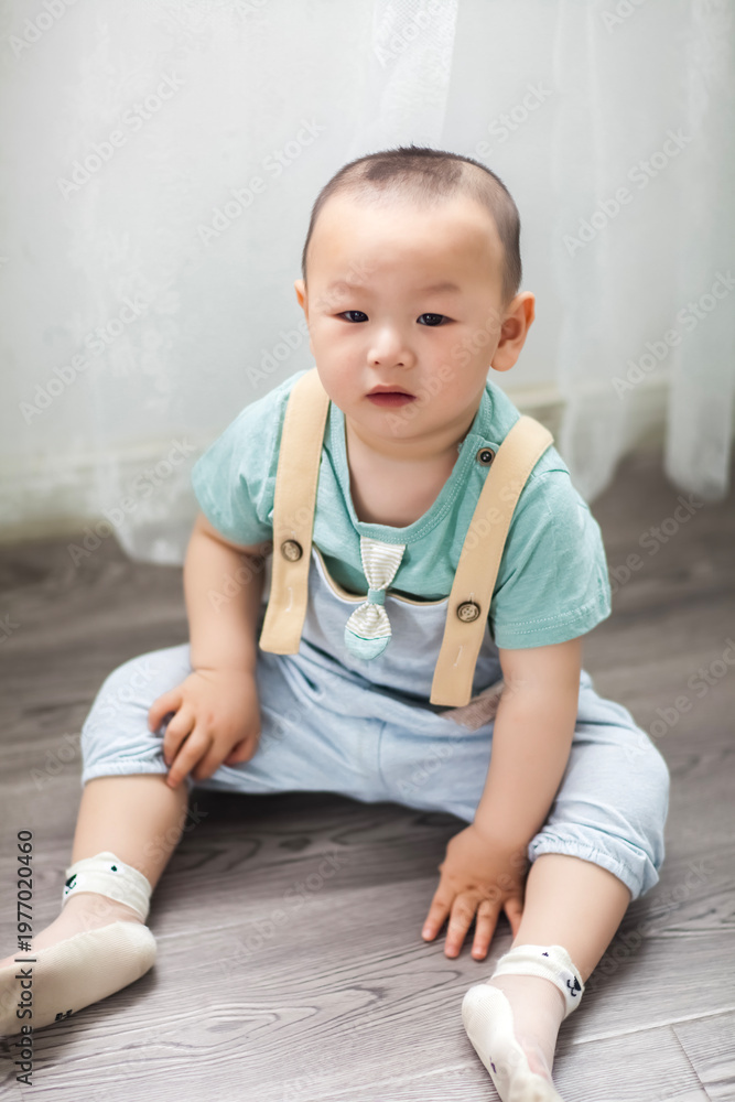 Fototapeta premium Cute Asian boy indoors