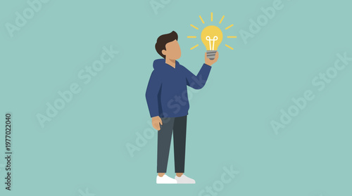 Man in blue hoodie holding a bright lightbulb with rays symbolizing a great idea or inspiration