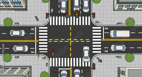 Aerial View of a Busy City Intersection with Cars and Pedestrians.
