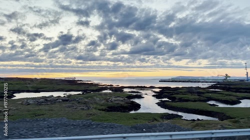 Seascape landscape, beautiful view of the sea and Iceland coast at dawn, serenity view of the water texture, coastal infrastructure, Iceland landscape.