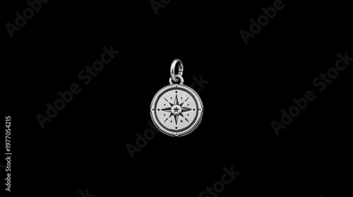 Ornate Silver Compass Pendant Isolated on Black Background