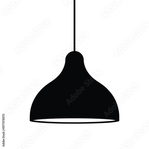 A simple black pendant lamp hangs from the ceiling a striking graphic silhouette