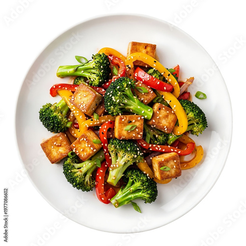 A plate of stir fried tofu broccoli and peppers