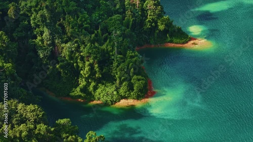 Aerial view of Khao Sok national park's lush cliffs and blue clear waters, Thailand.