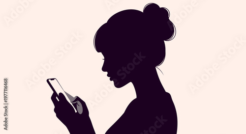 Silhouette of a young woman with her hair in a bun, looking intently at her smartphone screen.