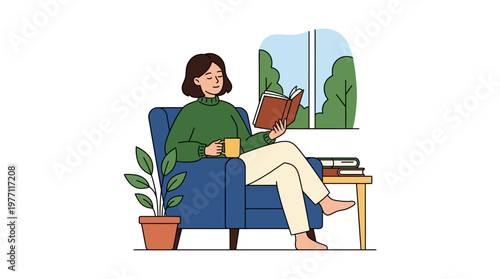 Woman sitting in a blue armchair reading a book with a cup of coffee beside her