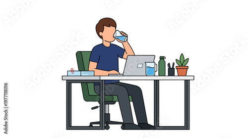 A man sits at a desk drinking water from a glass while working on his laptop computer