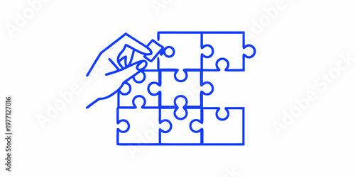 Hand placing the final piece into a blue line art puzzle