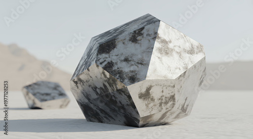 Large white and grey marble geometric rock sculpture on a flat desert landscape at daytime