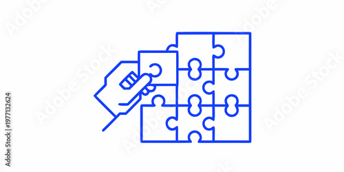 Hand fitting a puzzle piece into a partially completed jigsaw puzzle