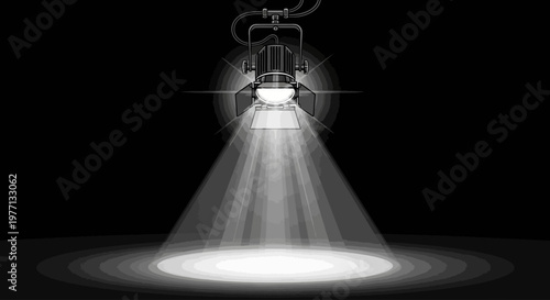 Professional theatrical spotlight shining a bright beam of light in a dark studio.