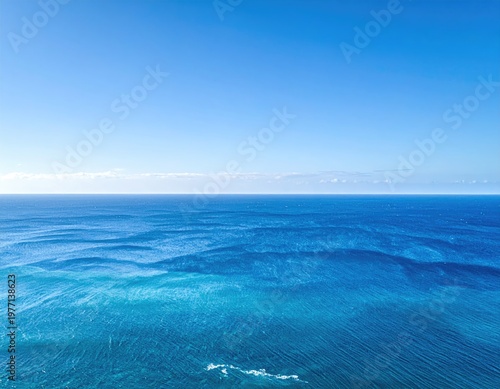 Clear blue ocean meets a clear blue sky