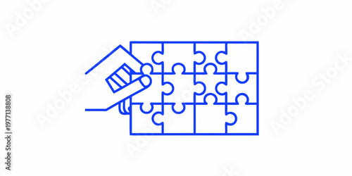 Hand fitting a puzzle piece into a partially completed jigsaw puzzle