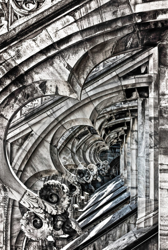 Black and white details of Milan Cathedral s Gothic ornaments aligned in precise geometric patterns across the facade
