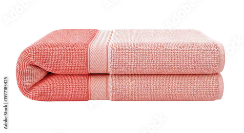 Two folded coral colored towels with textured pattern