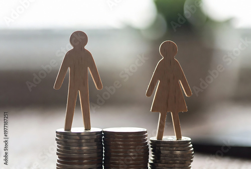 Two wooden figures representing a man and woman stand on stacks of coins, symbolizing economic disparity.