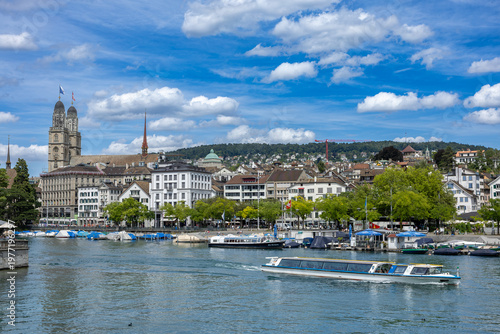 Bilde på lerret Zurich old town skyline limmat river boat historic building church tower Switzer
